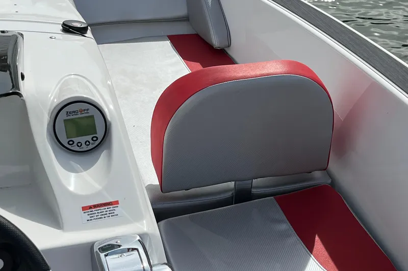 Slide: The Image of 2017 Heyday WT-1 boat interior with red and gray seating and control panel. - 4