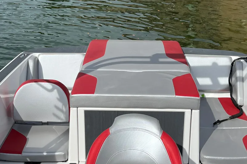 Slide: The Image of 2017 Heyday WT-1 boat interior with red and gray seating on water. - 5