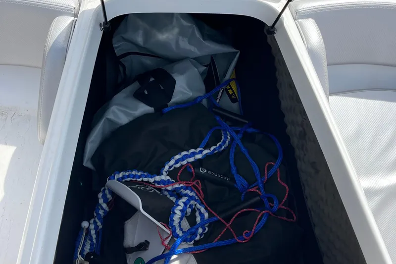 Slide: The Image of Storage compartment in a 2017 Heyday WT-1 boat with ropes and bags. - 11