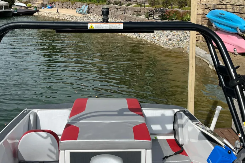 Slide: The Image of 2017 Heyday WT-1 boat docked by a lakeside with colorful kayaks. - 6