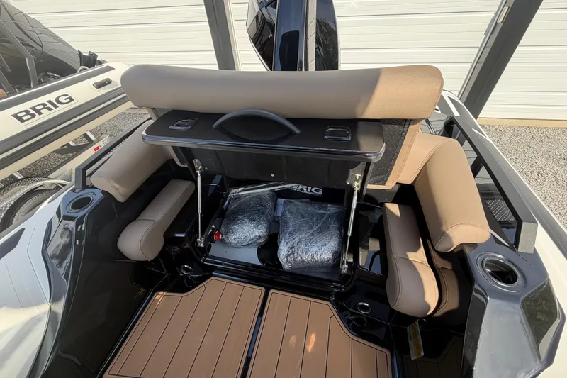 Slide: The Image of 2026 Brig Eagle 6.7 boat interior with tan seating and modern design. - 11