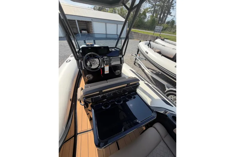 Slide: The Image of Interior view of 2026 Brig Eagle 6.7 boat with modern dashboard and seating. - 12