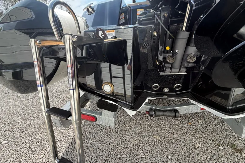 Slide: The Image of Rear view of 2026 Brig Eagle 6.7 boat with ladder and engine components. - 3