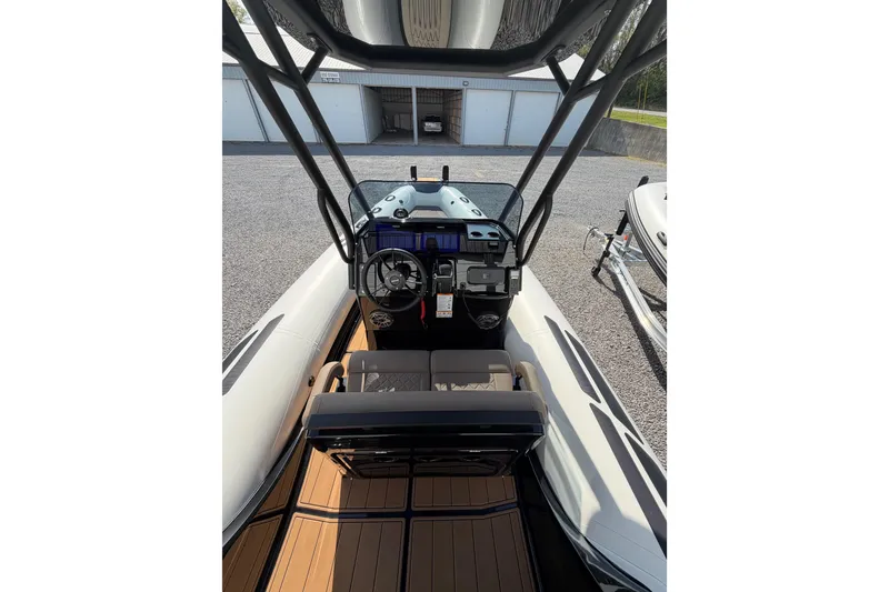 Slide: The Image of 2026 Brig Eagle 6.7 boat cockpit with modern controls and seating. - 7