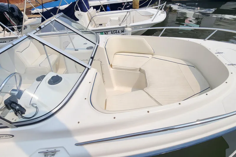 Slide: The Image of 2001 Sea Hunt 19 Dual Console boat with spacious seating and sleek design. - 12