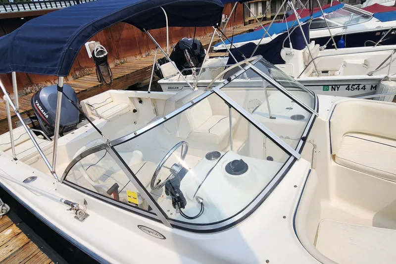 Slide: The Image of 2001 Sea Hunt 19 Dual Console boat with Yamaha engine, docked at marina. - 13