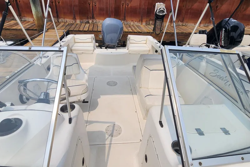 Slide: The Image of 2001 Sea Hunt 19 Dual Console boat interior with seating and steering wheel. - 5