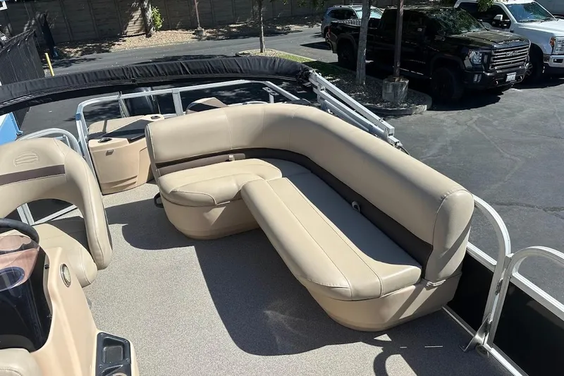 Slide: The Image of 2019 Sun Tracker Bass Buggy 18 DLX pontoon boat with beige seating and spacious deck. - 13