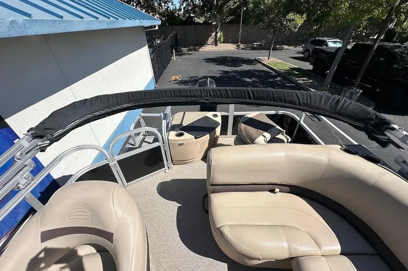 Slide: The Image of 2019 Sun Tracker Bass Buggy 18 DLX pontoon boat interior with beige seating. - 15