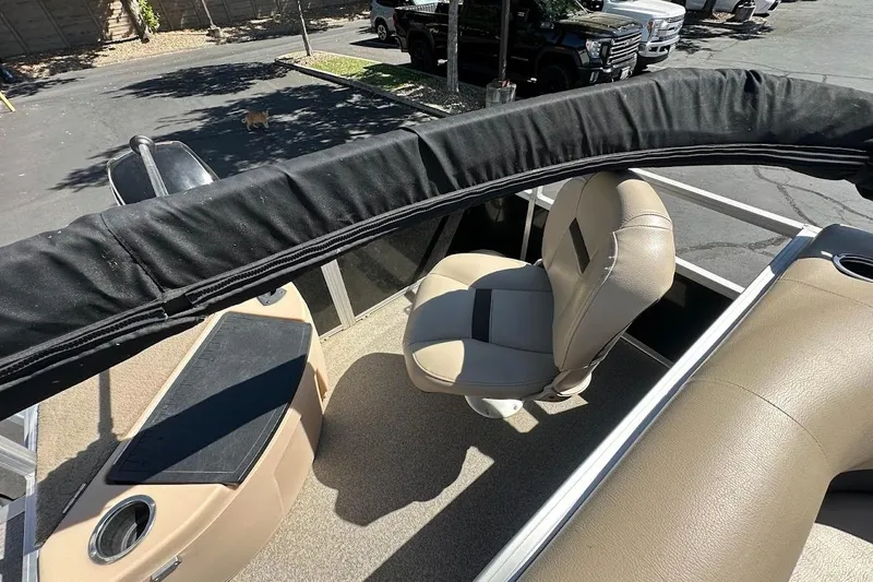 Slide: The Image of 2019 Sun Tracker Bass Buggy 18 DLX interior with seating and storage compartments. - 16