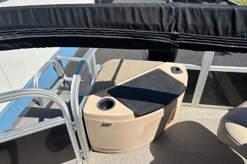 Slide: The Image of 2019 Sun Tracker Bass Buggy 18 DLX pontoon boat interior with seating and storage. - 17