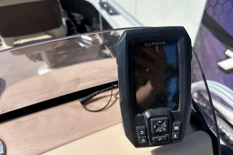 Slide: The Image of Garmin device on 2019 Sun Tracker Bass Buggy 18 DLX boat dashboard. - 22