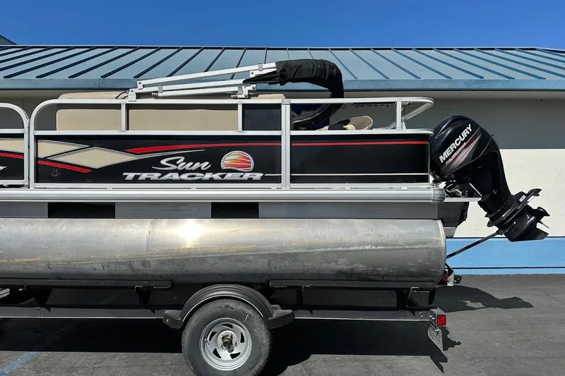Slide: The Image of 2019 Sun Tracker Bass Buggy 18 DLX pontoon boat with Mercury outboard motor. - 7