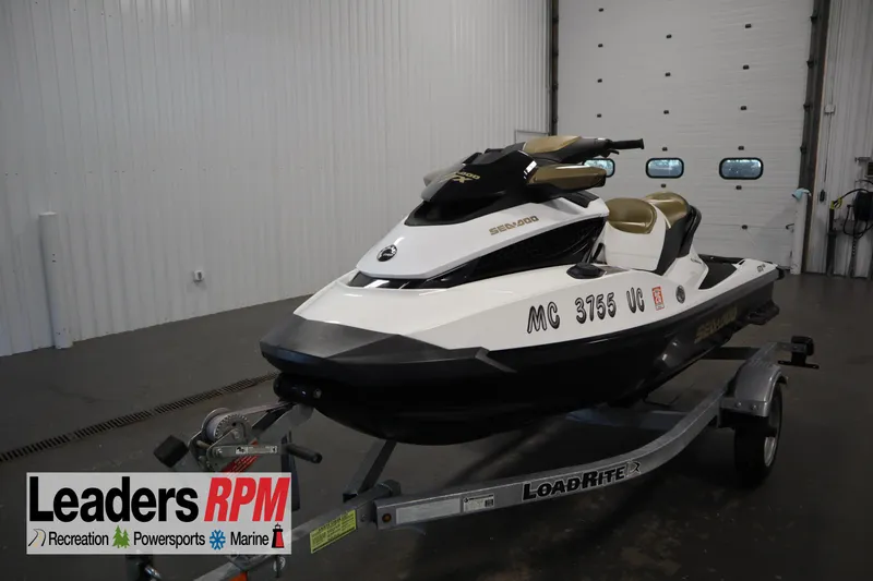The Image of 2013 Sea-Doo GTX 215 jet ski on trailer in indoor showroom. - 1