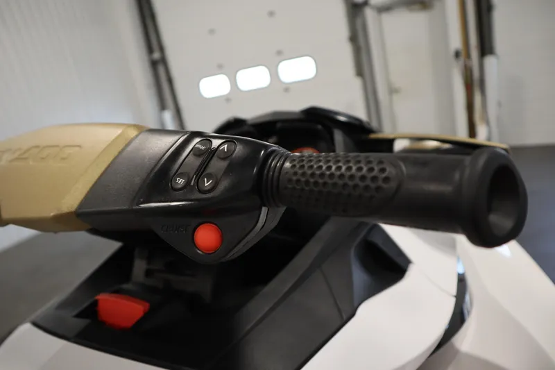 Slide: The Image of 2013 Sea-Doo GTX 215 handlebar controls in a garage setting. - 16