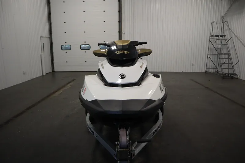 Slide: The Image of 2013 Sea-Doo GTX 215 jet ski in a garage, front view. - 2