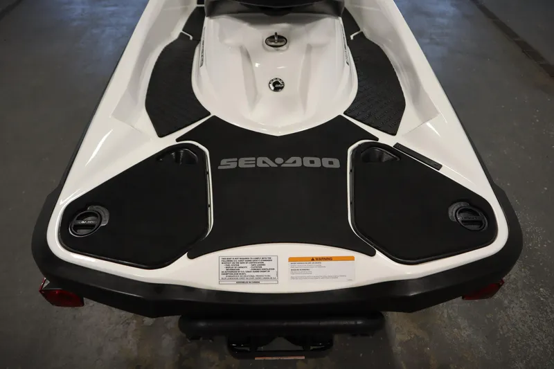 Slide: The Image of 2013 Sea-Doo GTX 215 rear view, showcasing black and white design with logo. - 23