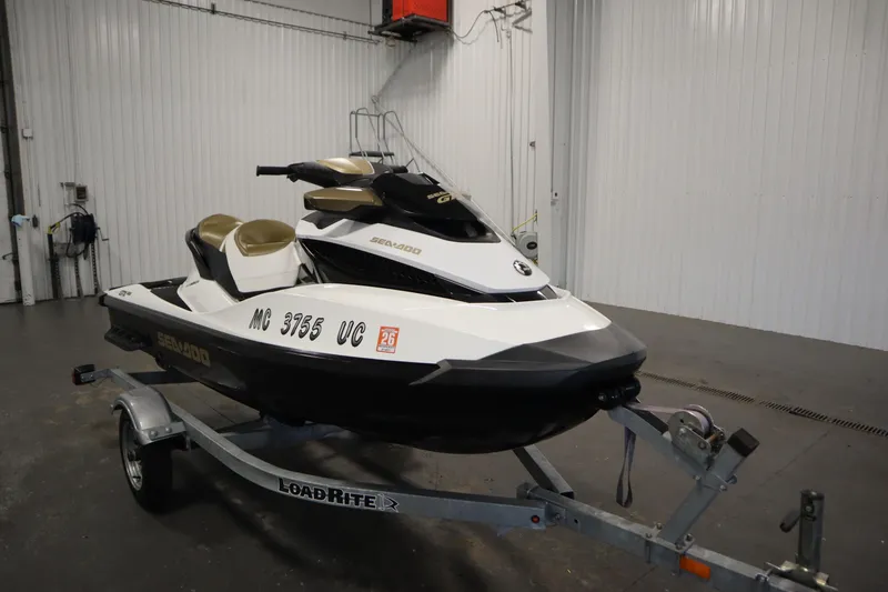 Slide: The Image of 2013 Sea-Doo GTX 215 jet ski on trailer in indoor storage facility. - 3