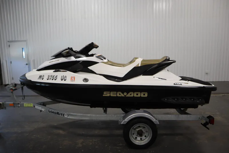 Slide: The Image of 2013 Sea-Doo GTX 215 jet ski on trailer in indoor setting. - 8