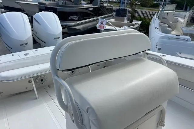 Slide: The Image of 2004 Jupiter 31 Center Console boat with dual 300 HP engines and white seating. - 15