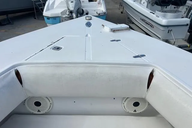 Slide: The Image of 2004 Jupiter 31 Center Console boat deck with seating and speakers. - 21