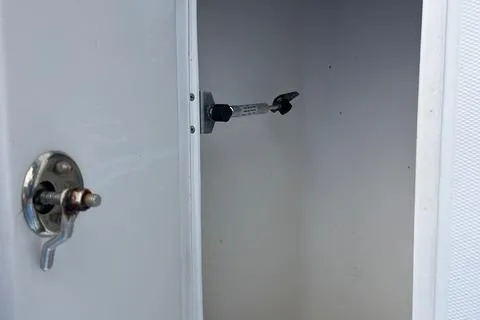 Slide: The Image of Open storage compartment on 2004 Jupiter 31 Center Console boat. - 31