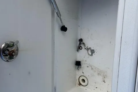 Slide: The Image of Storage compartment of a 2004 Jupiter 31 Center Console boat, showing interior details. - 32