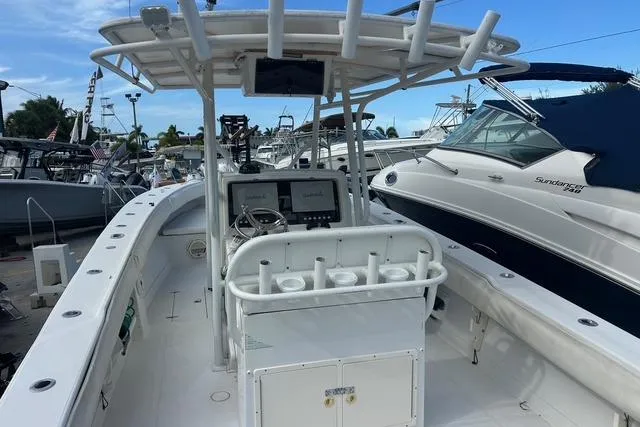 Slide: The Image of 2004 Jupiter 31 Center Console boat with spacious deck and modern navigation equipment. - 5