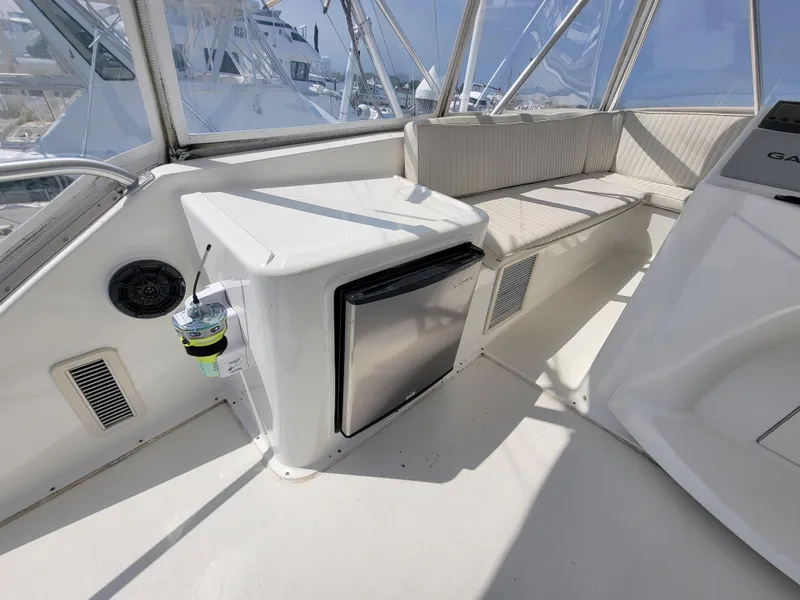 Slide: The Image of 2001 Ocean Yachts 56 Super Sport cockpit with seating and mini fridge. - 13