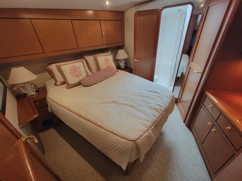Slide: The Image of Luxurious bedroom in 2001 Ocean Yachts 56 Super Sport with ensuite bathroom. - 29
