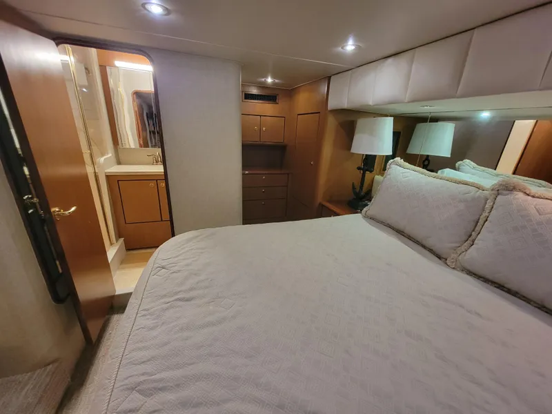 Slide: The Image of Luxurious bedroom in 2001 Ocean Yachts 56 Super Sport with ensuite bathroom. - 38