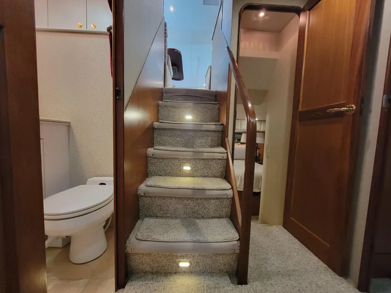 Slide: The Image of Interior stairs of 2001 Ocean Yachts 56 Super Sport, leading to upper deck. - 39