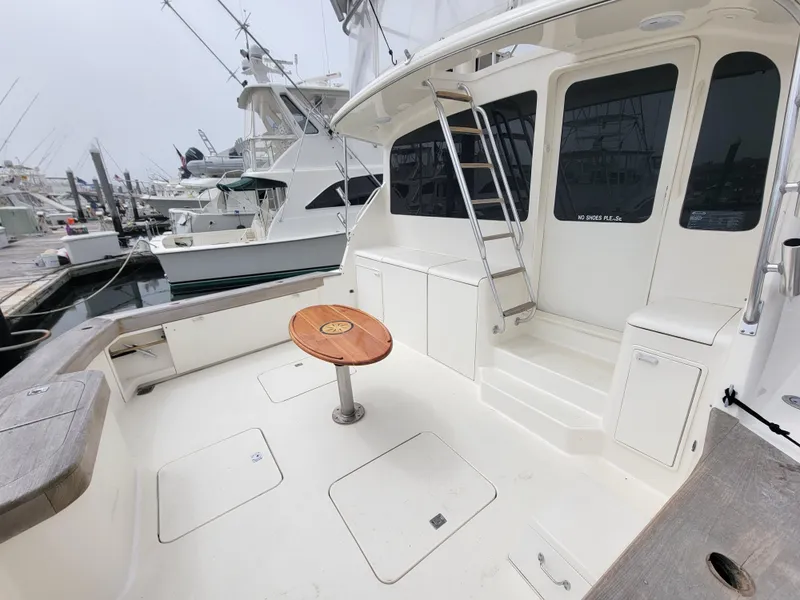 Slide: The Image of 2001 Ocean Yachts 56 Super Sport boat deck with seating and table. - 44