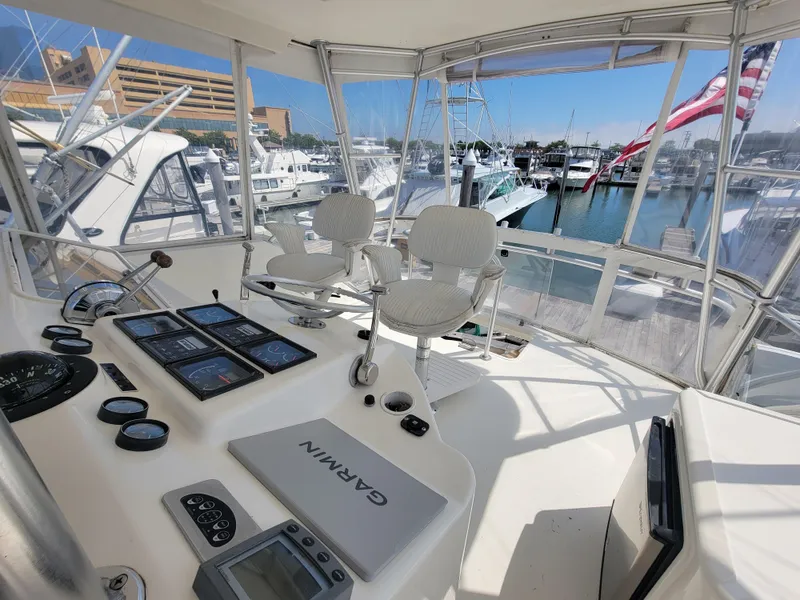 Slide: The Image of Helm station of 2001 Ocean Yachts 56 Super Sport with Garmin navigation system. - 11