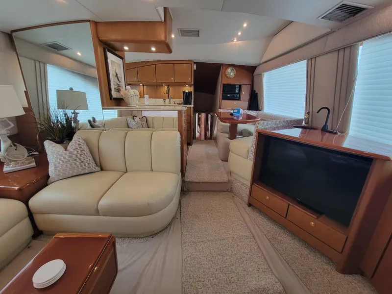 Slide: The Image of Luxurious interior of 2001 Ocean Yachts 56 Super Sport with modern furnishings and entertainment system. - 17
