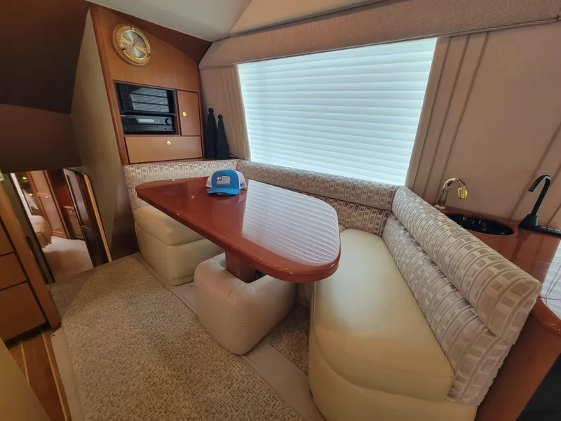 Slide: The Image of Luxurious dining area in a 2001 Ocean Yachts 56 Super Sport boat. - 20