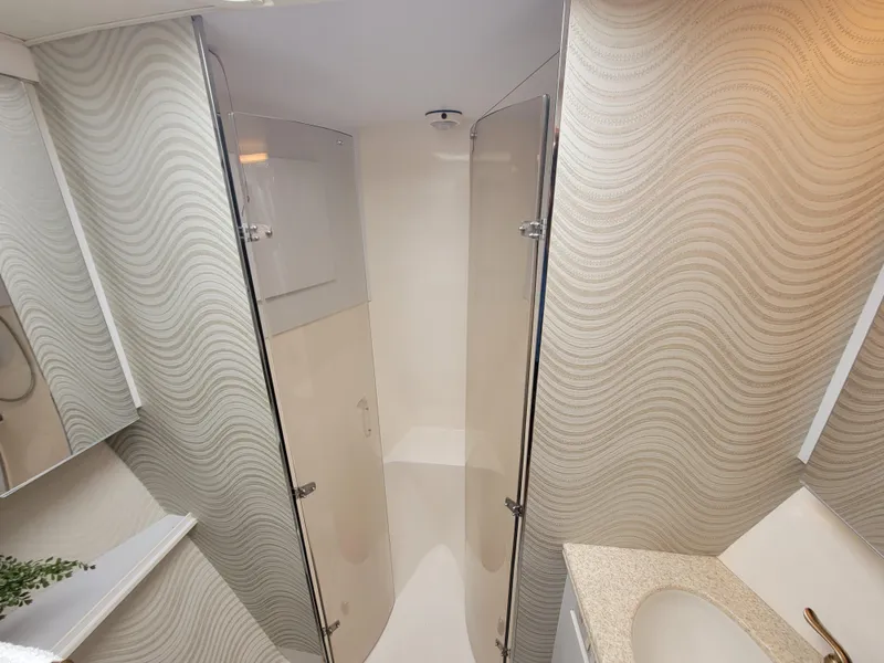 Slide: The Image of Bathroom interior of 2001 Ocean Yachts 56 Super Sport with modern shower and sink. - 31