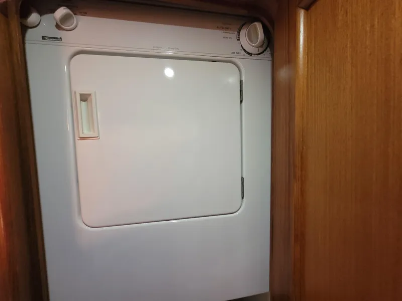 Slide: The Image of Laundry dryer inside 2001 Ocean Yachts 56 Super Sport. - 40