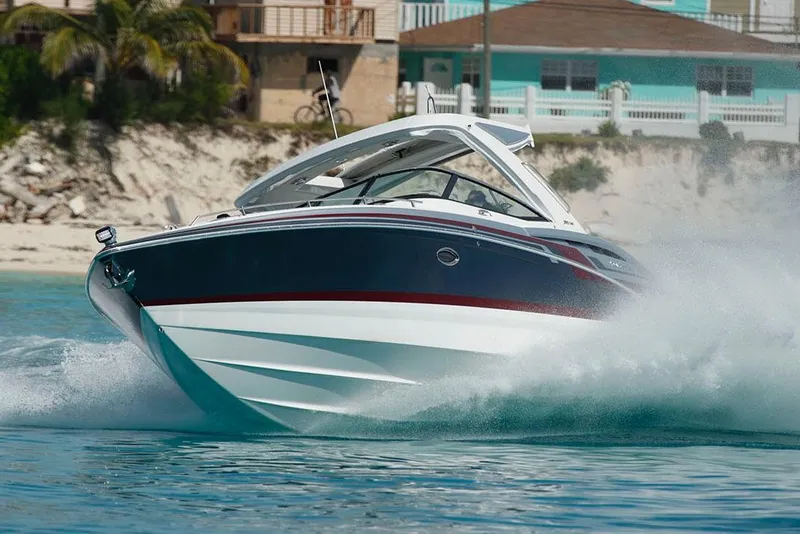 The Image of 2026 Formula 350 Crossover Bowrider I/O on a serene lake, surrounded by lush greenery. - 0