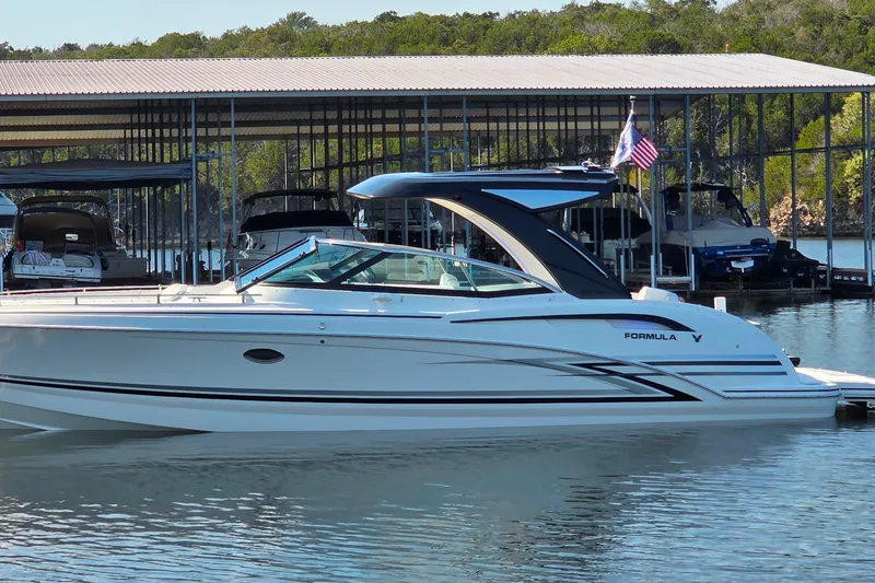 Slide: The Image of 2026 Formula 350 Crossover Bowrider I/O interior with luxurious seating and modern design. - 14