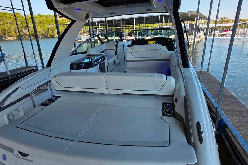 Slide: The Image of 2026 Formula 350 Crossover Bowrider I/O with spacious seating and sleek design on water. - 21