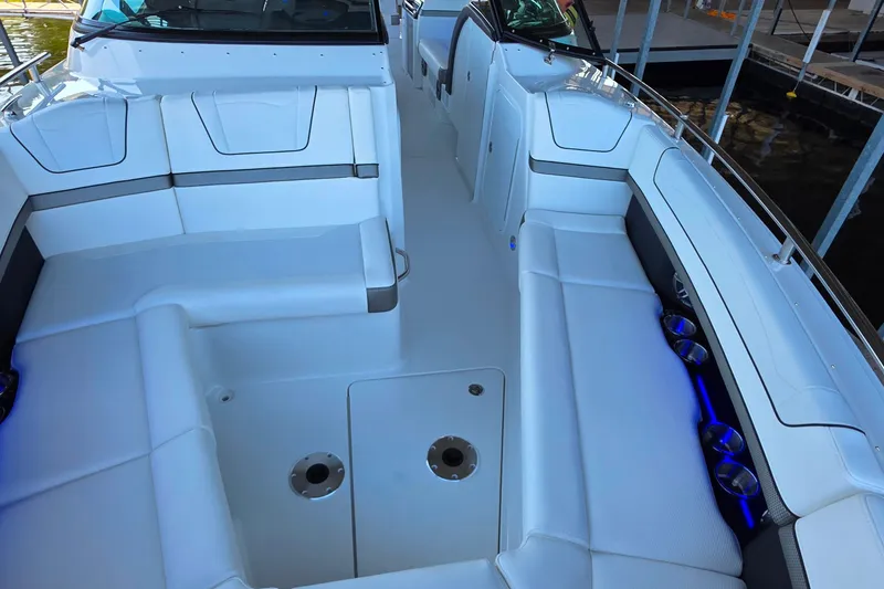 Slide: The Image of 2026 Formula 350 Crossover Bowrider I/O interior with TV and seating area. - 31