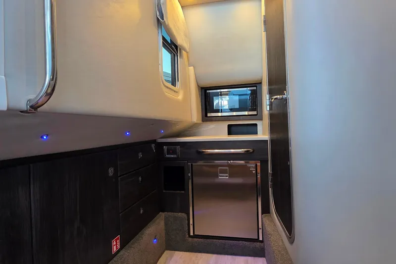 Slide: The Image of Manufacturer Provided Image: 2026 Formula 350 Crossover Bowrider I/O with spacious seating and table on calm water. - 38