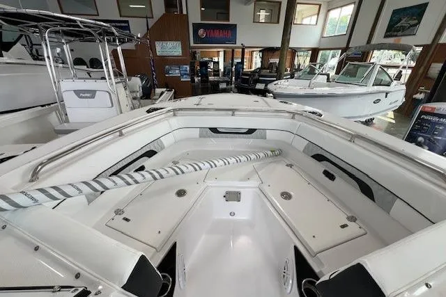 Slide: The Image of 2026 Blackfin 252 DC boat interior in showroom, featuring spacious seating and modern design. - 12