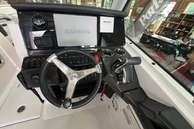 Slide: The Image of 2026 Blackfin 252 DC boat dashboard with Garmin display and Mercury controls. - 13