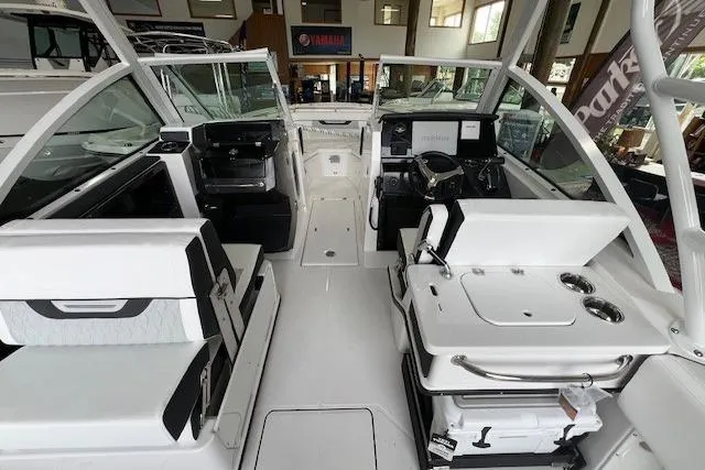 Slide: The Image of Interior view of 2026 Blackfin 252 DC boat, showcasing seating and control panel. - 14
