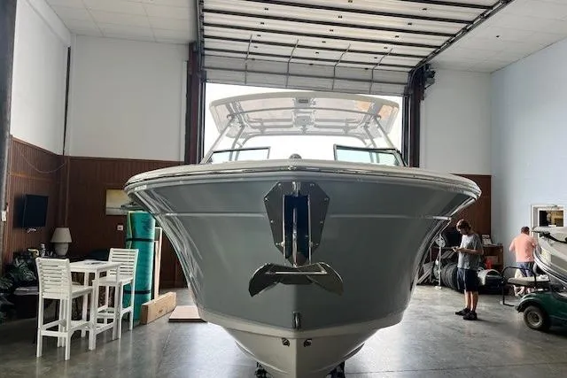 Slide: The Image of 2026 Blackfin 252 DC boat in a spacious indoor storage facility. - 3