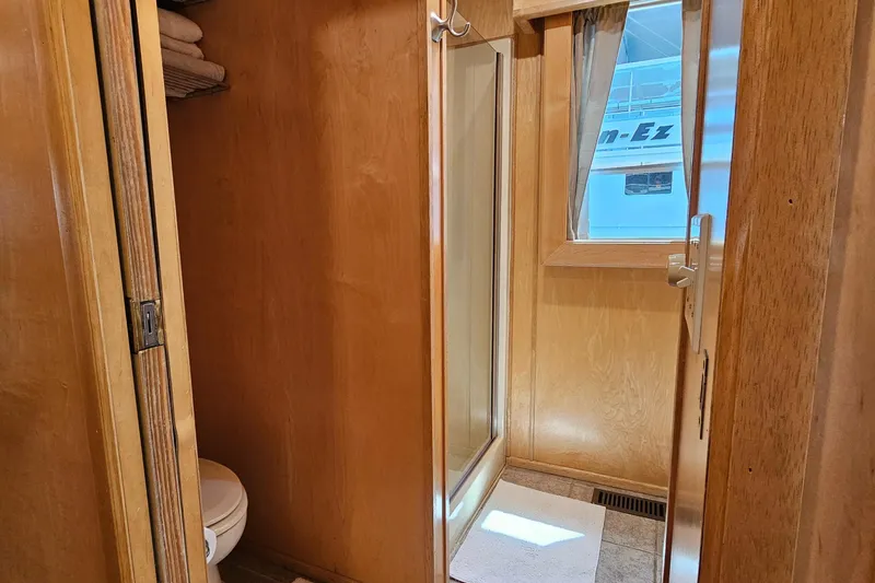 Slide: The Image of Compact bathroom in 2001 Fantasy 18x80 houseboat with wooden interior and shower. - 24