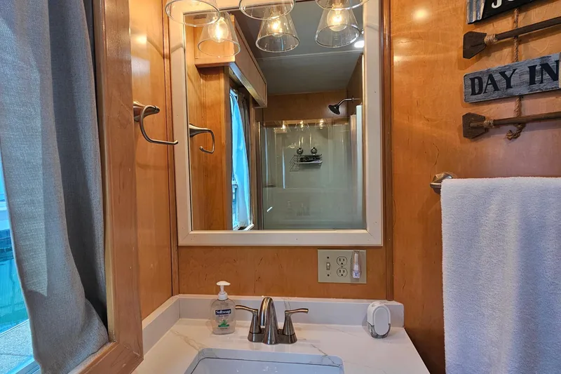 Slide: The Image of Bathroom interior with wooden walls, mirror, and modern fixtures in a Fantasy 18x80 model. - 27