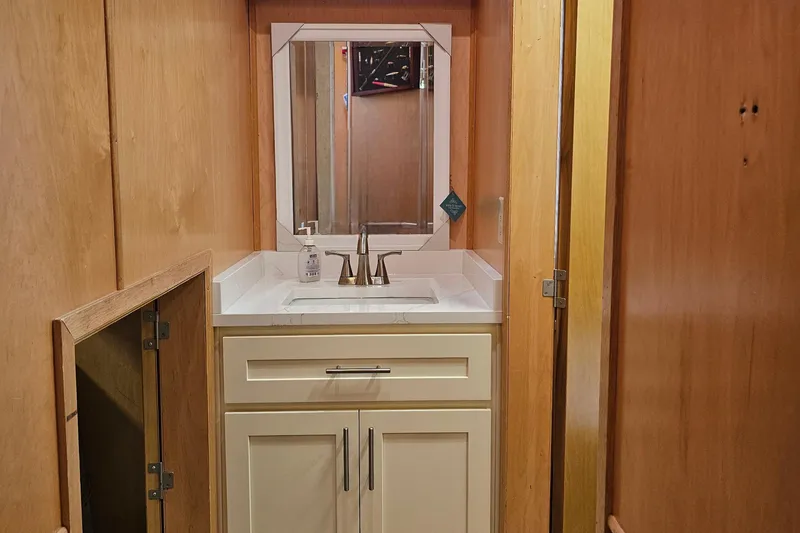 Slide: The Image of Small bathroom vanity with mirror in a 2001 Fantasy 18x80 model. - 32